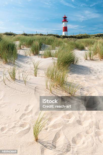 Sand Dune And Lighthouse On Background Stock Photo - Download Image Now - German North Sea Region, Beach, Travel