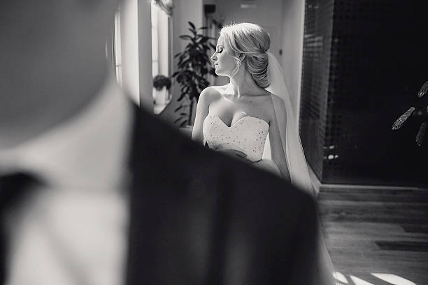 istock blonde bride with her groom 485964120