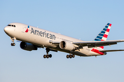 Zurich, Switzerland - April 16, 2014: American Airlines Boeing 767-300/ER departing Zurich International Airport on a clear and sunny day.