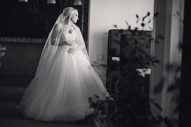 istock blonde bride with her groom 485964298