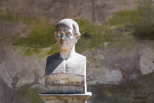 In a park on a hill above city center of Rome, there are many statues - busts of important personalities. One of them is bust of antique greek painter.
