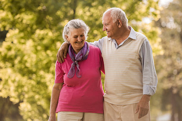 istock Embraced senior couple taking a walk in nature and talking. 485965764