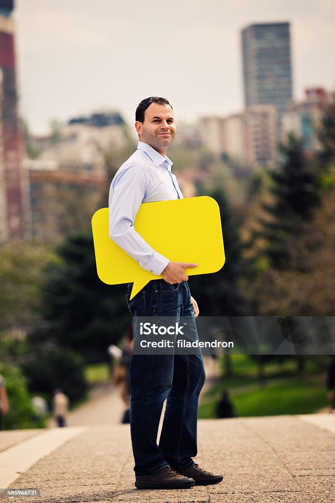 Social Network Man with color speech bubbles outdoors 30-39 Years Stock Photo