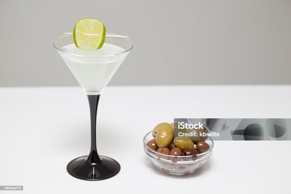 mojito cocktail with lime mixed green olives in glass bowl mojito cocktail with lime mixed green olives in glass bowl - handy snack or nibbles - selective DOF Appetizer Stock Photo