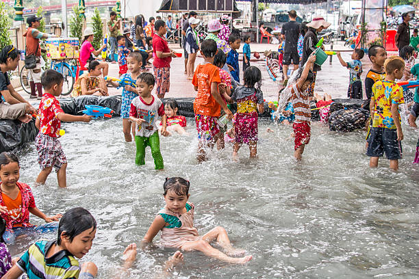 Bangkok -Thailand - April 14,2014: Thai Children enjoy in the pool on Songkran Festival is celebrated in Thailand as the traditional New Year's Day from 13 to 15 April with splashing water at each other.
