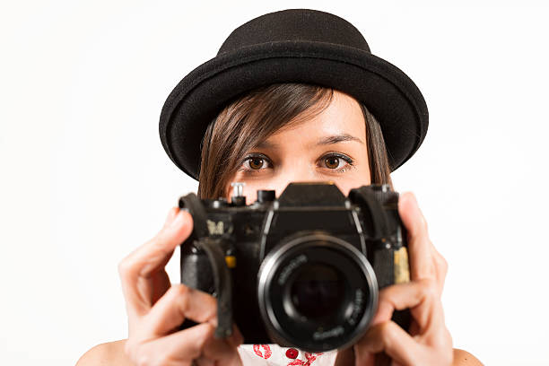 istock Young woman with retro photocamera 485968772