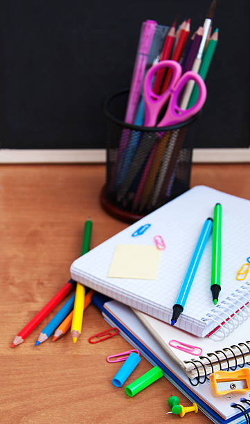 istock school supplies and blackboard 485969368
