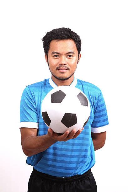istock Young soccer football player on white 485969625
