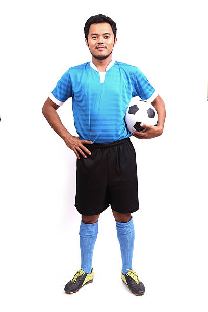 istock Young soccer football player on white 485969715