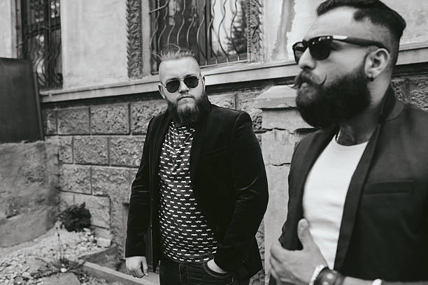 istock Two bearded businessman looking at phone 485970096