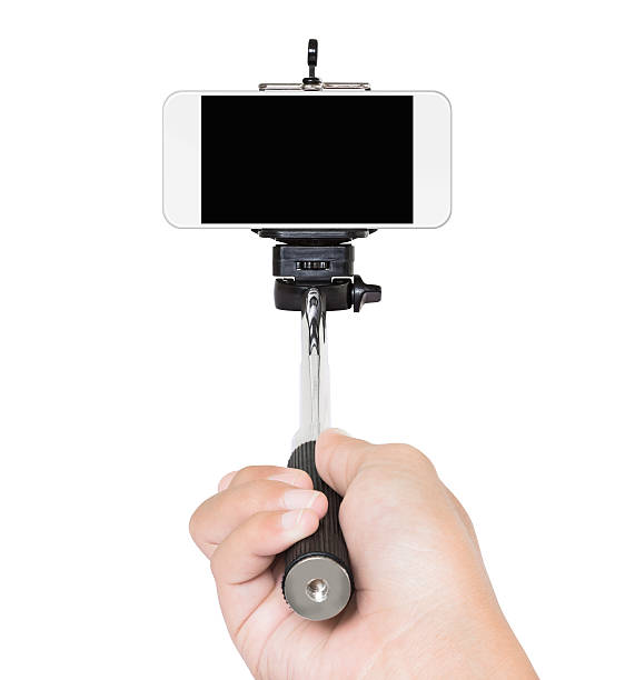 istock hand holding selfie stick isolated white clipping path inside 485974150
