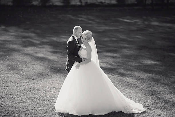 istock blonde bride with her groom 485977172