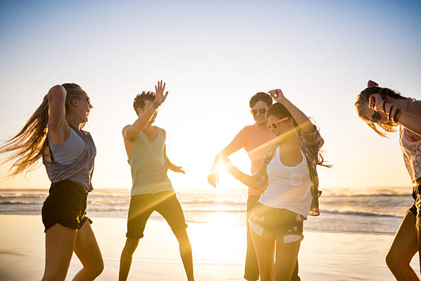 istock Friends dancing on beach in sunset 485978917