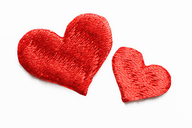 istock Two red heart shape embroidery on white background 485979551