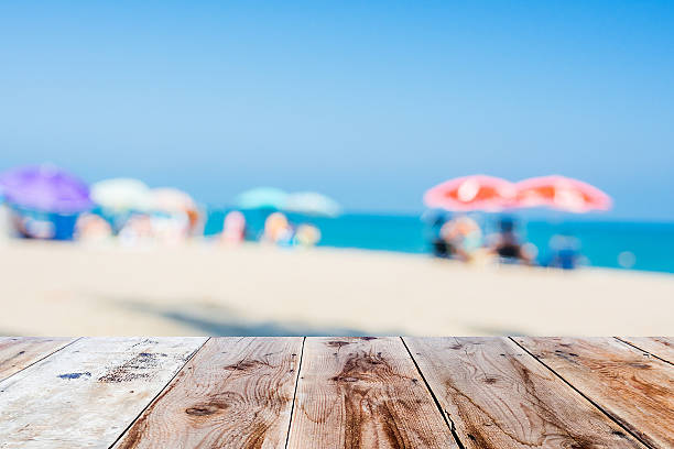 istock wooden floor and blurred beach atmosphere 485980214