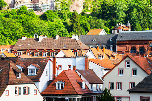 Buildings and roof of historical center Heidelberg. Seen from old bridge over Neckar. Summertime in Baden-Württemberg.