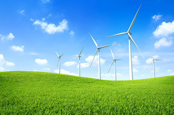 Wind turbine on a green field stock photo