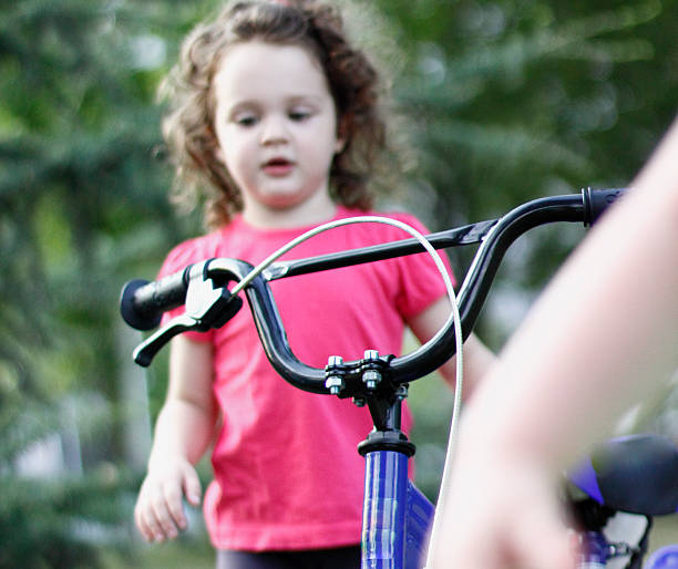 istock Beautiful young girl with bicycle 485981716