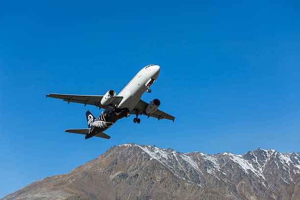 Queenstown, New Zealand - September 1, 2014: Air New Zealand plane takes off in Queenstown International Airport in Queenstown, New Zealand. Queenstown International Airport  has been voted the world's most scenic airport approach