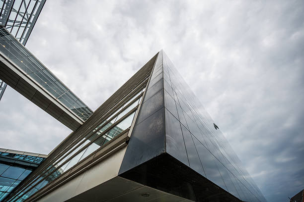 Copenhagen, Denmark - August 08, 2015: Den Sorte Diamant - Black Diamond - facade is made of black granite.Looking upwards the facade seem to melt into the sky.