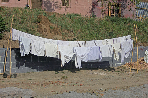 Cloths are hanging on clothesline