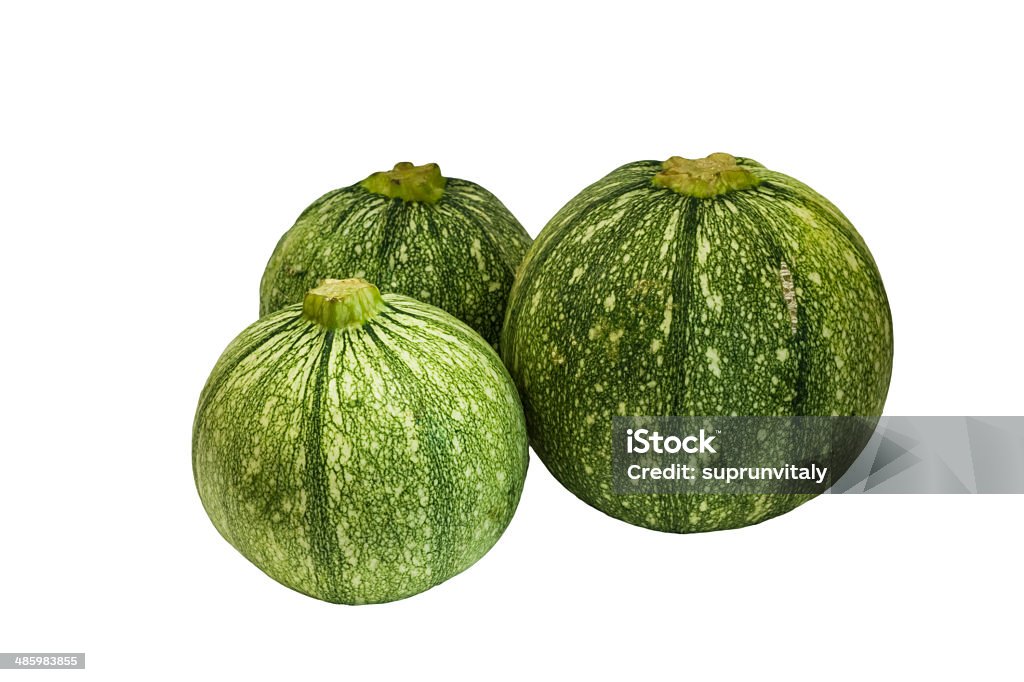 Round zucchini . Photography round green zucchini isolated on a white background. Agricultural Fair Stock Photo