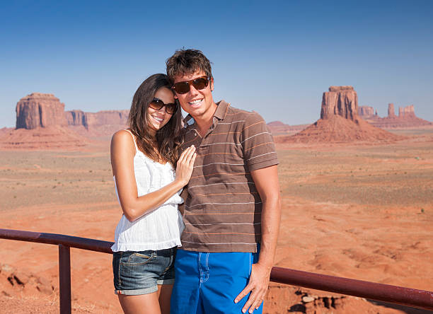 istock Monument Valley, Tourists Couple taking their Picture 485984317