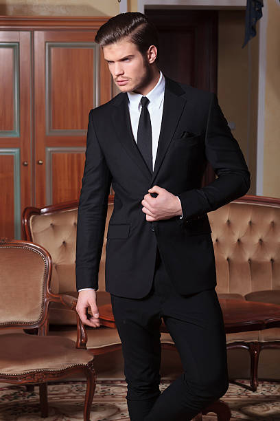 istock business man unbuttons suit looking away 485984335