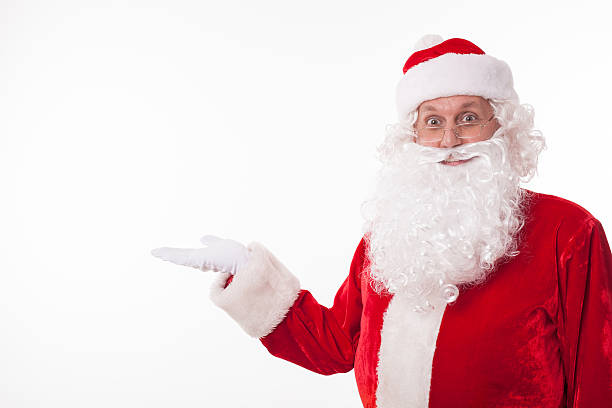 istock Cheerful Father Christmas is advertising something interesting 485986726