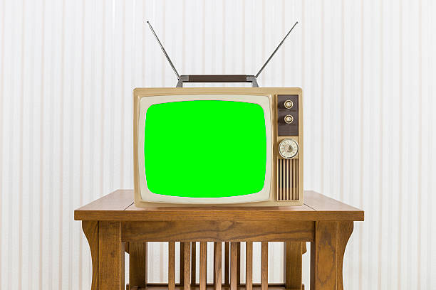 istock Old Television with Antenna on Wood Table with Chroma Screen 485987192