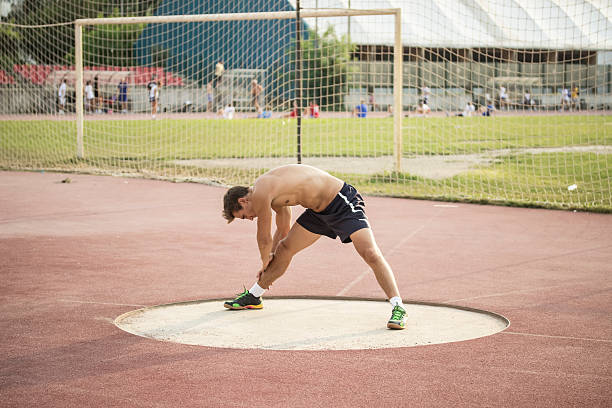 istock Muscular athlete stretching his legs. 485989778