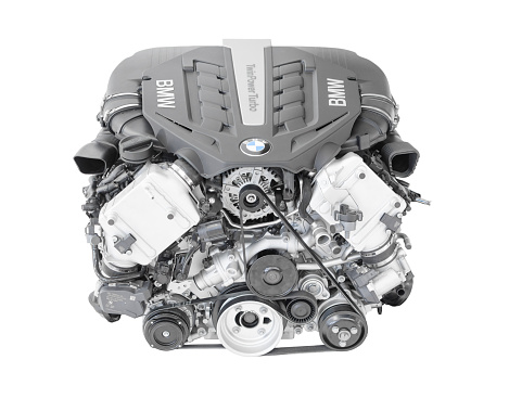 Munich, Germany - September 28, 2014: New modern flagship top model of irresistibly dynamic and incredibly efficient car engine. BMW TwinPower turbo V8-cylinder top-of-the-range petrol engine isolated on white. This image was obtained under studio conditions on a white background and has not been altered.