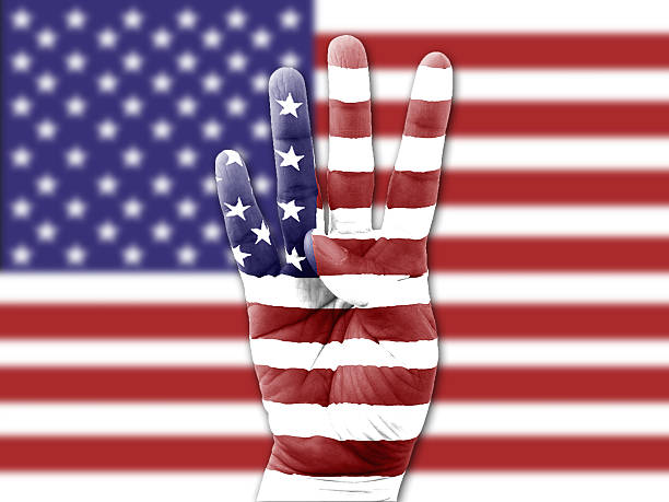 istock woman hand flag USA flag background 485990056