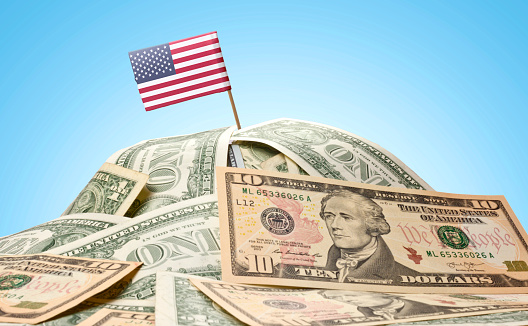 Flag of USA sticking in american banknotes.(series)