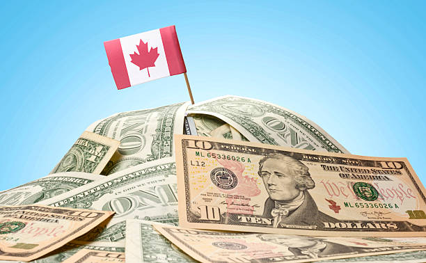 istock Flag of Canada sticking in american banknotes.(series) 485990554
