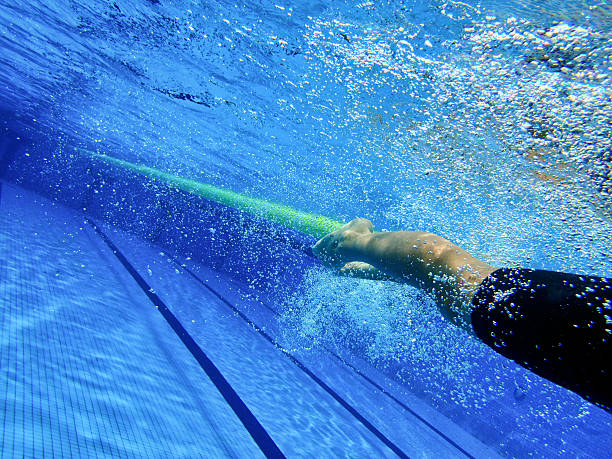 istock Underwater view of children swimmers in training 4 485991372