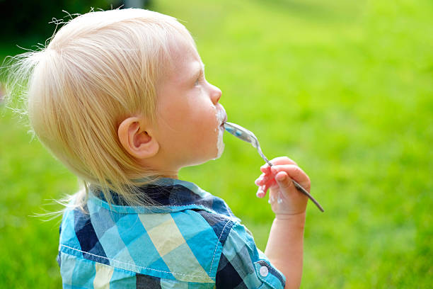 istock Baby boy on green 485991878
