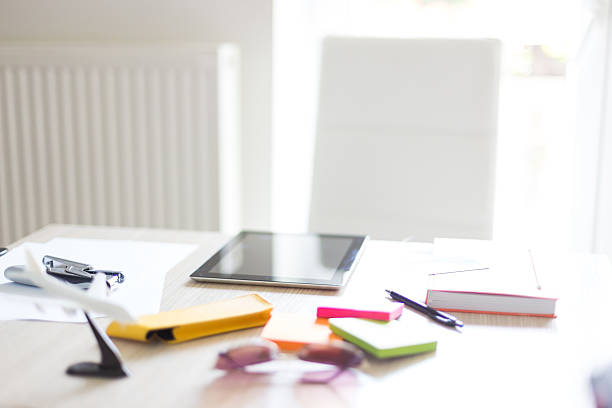 istock Wood desk and office supplies 485997576