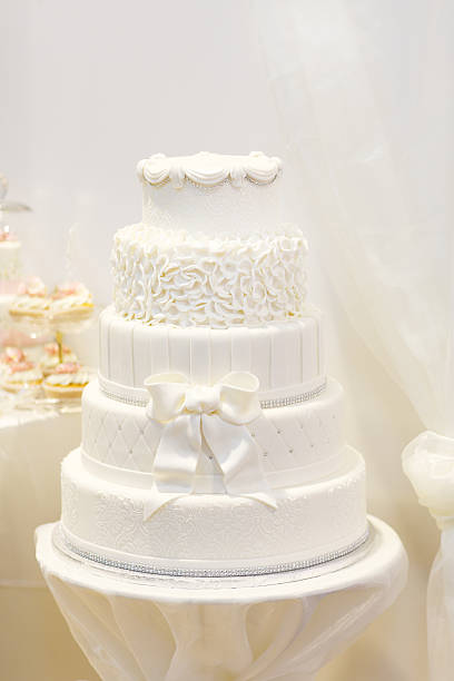 istock Beautiful wedding cake in white with five different levels. 485999119