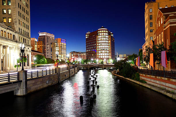 Providence Canal at Dusk Downtown Providence canal at dusk.  Providence is the capital and most populous city in Rhode Island.  Downtown Providence has numerous 19th-century mercantile buildings in the Federal and Victorian architectural styles. Providence is known for its nationally renowned restuarants,great museums, and galleries	 providence rhode island stock pictures, royalty-free photos & images