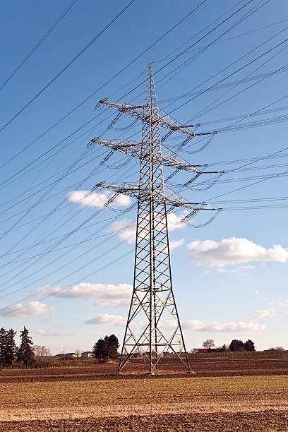 istock electrical pylon in rural landscape with blue sky 486001183
