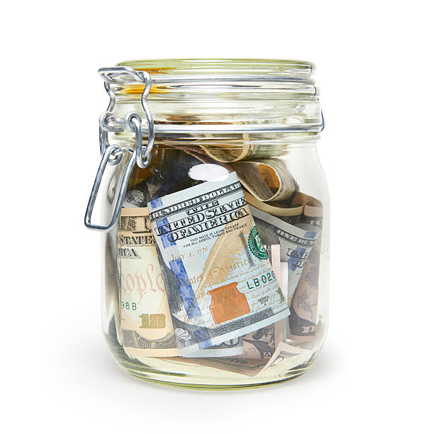 istock Jar full of dollars 486001841