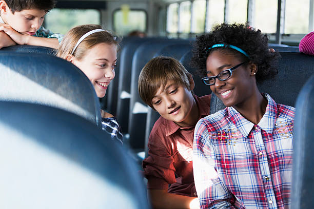 istock Children riding school bus 486002257