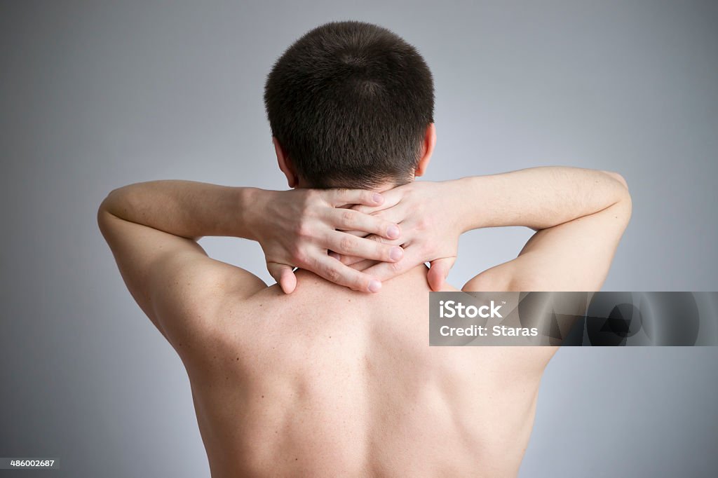 Neck pain in men Neck pain in men. Touching the body. Back Stock Photo