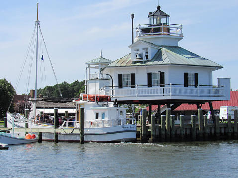 St. Michaels, Maryland, USA --August 21, 2015:  Chesapeake Bay Maritime Museum in St. Michaels, Maryland on the Miles River on Maryland's Eastern Shore.  The Maritime Museum exhibits restored Chesapeake Bay boats and other artifacts, once used for fishing for oysters, crabs, and other seafood.  St Michaels is a picturesque historic village on the Miles River on Maryland's Eastern Shore.
