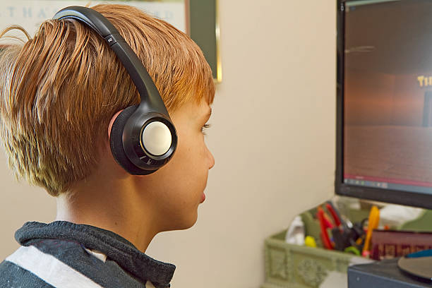 istock Closeup of Boy in Headset Playing Video games 486010682