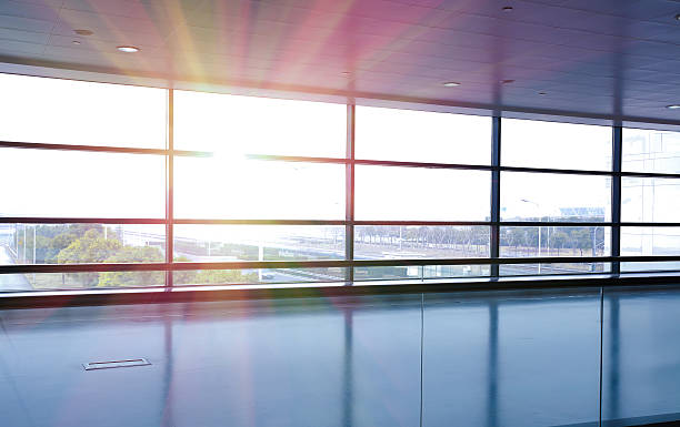 istock Modern airport interior glass wall aisle window 486017106