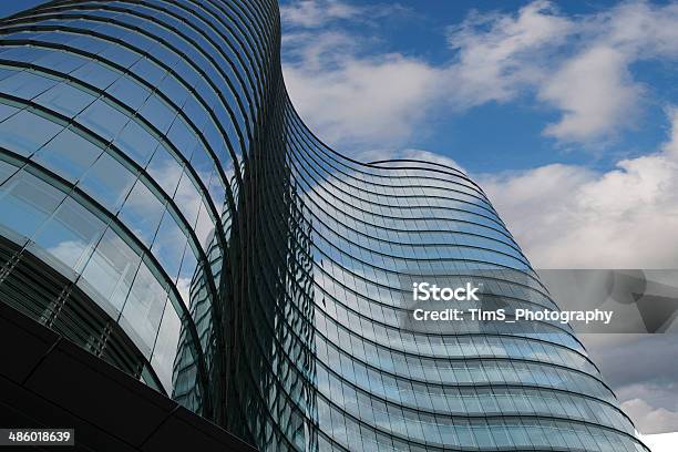 Skyscraper Mirror Windows With Clouds Reflections Stock Photo - Download Image Now - Apartment, Architecture, Blue