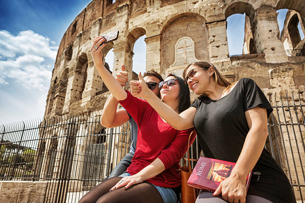 istock Tourists taking a selfie in front of the Coliseum, Rome 486020861