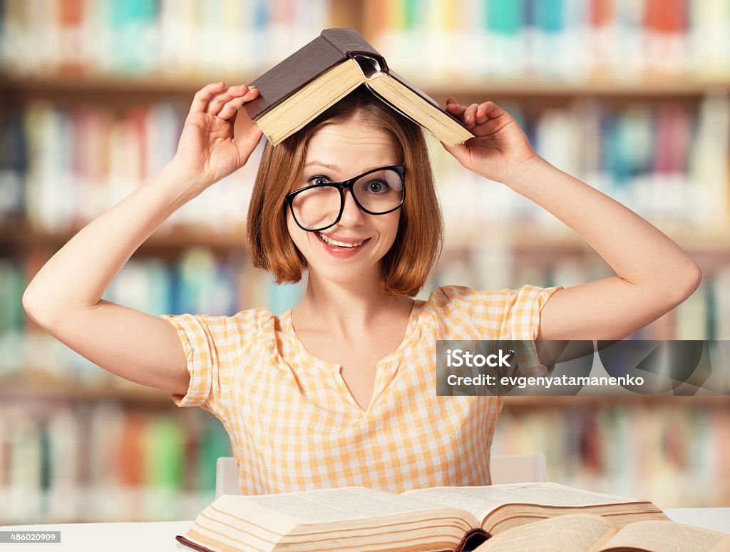 Tired Funny Girl Student With Glasses Reading Books Stock Photo - Download  Image Now - iStock